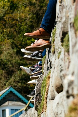 legs hanging over a steep edge